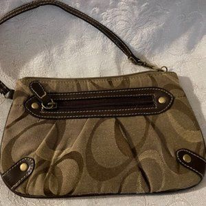 Tan and brown printed zip wristlet.  Zip NWOT